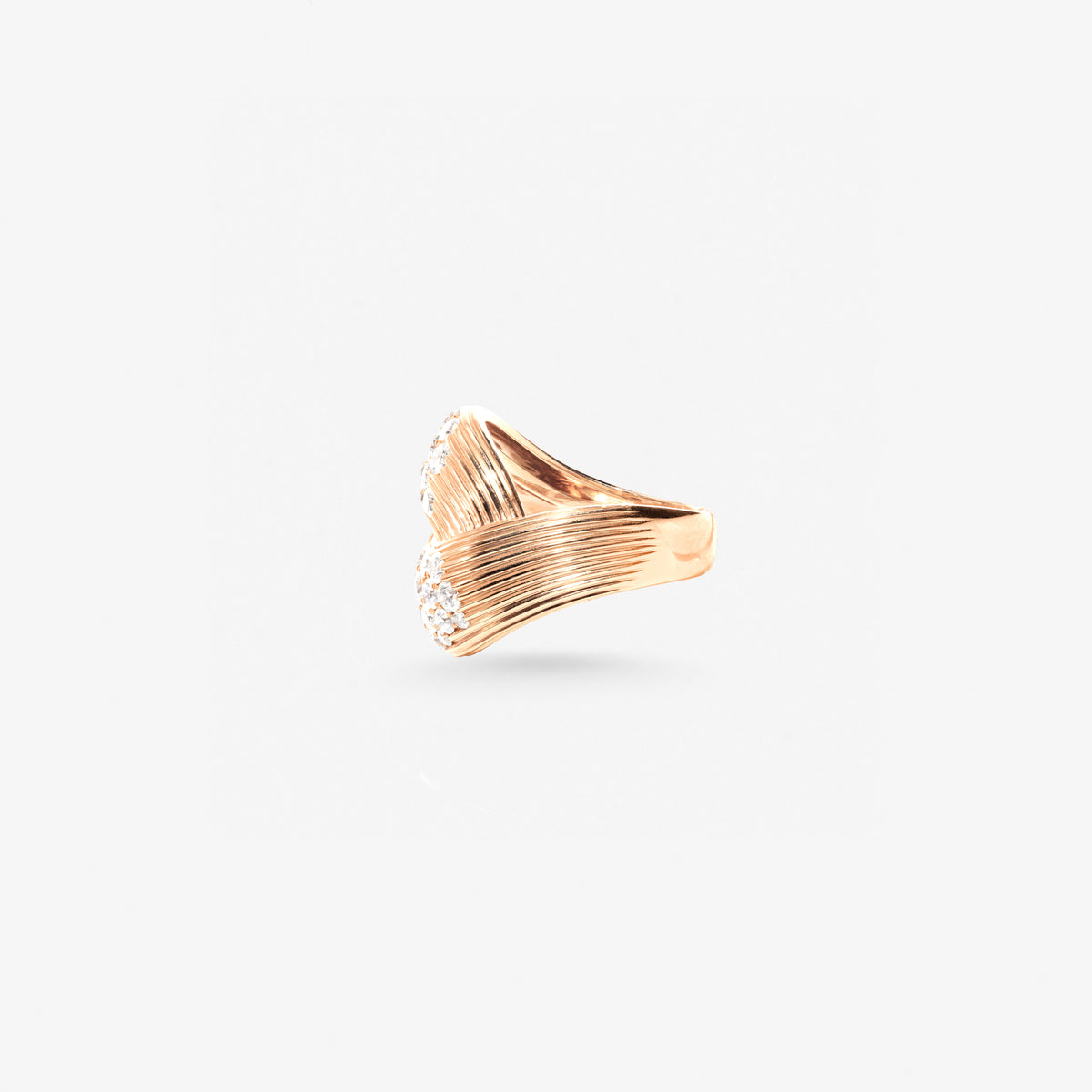 Peter Marco 18k rose gold round cut diamond bypass ring, side view