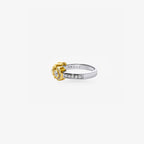 Peter Marco 18k two-tone white and yellow gold bezel set round cut diamond three-stone ring, side view