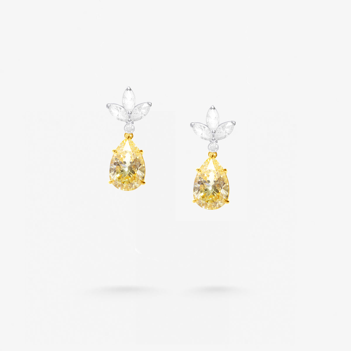 Peter Marco 18k white and yellow gold marquise cut white and pear shaped yellow diamond drop earrings
