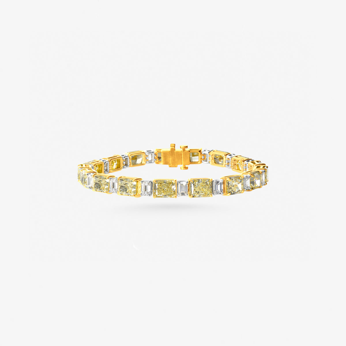 Peter Marco 18k white and yellow gold baguette cut diamond and cushion cut yellow diamond bracelet