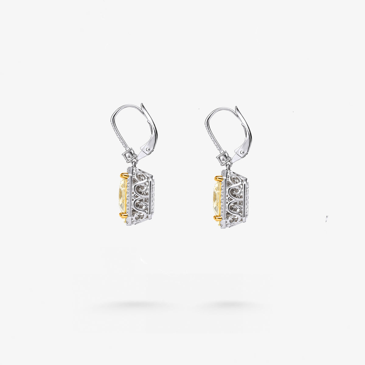 Peter Marco 18k white and yellow gold radiant cut yellow diamond with baguette and round cut white diamond drop earrings, side view