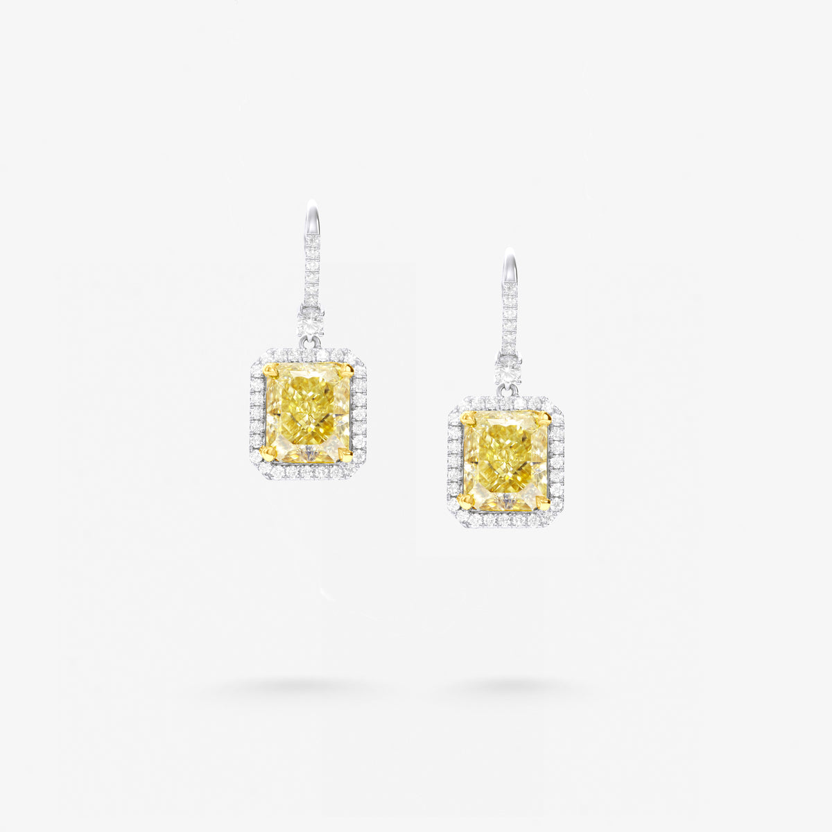 Peter Marco 18k white and yellow gold radiant cut yellow diamond with baguette and round cut white diamond drop earrings