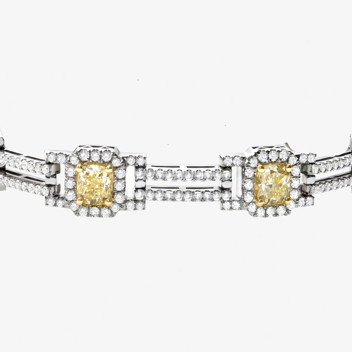 Peter Marco 18k white and yellow gold round cut diamond and cushion cut yellow diamond bracelet, detail view