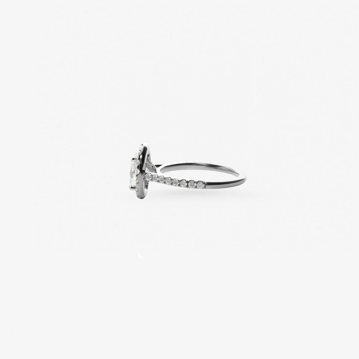 Peter Marco 18k white gold oval cut and round cut diamond halo ring, side view