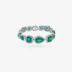 Peter Marco 18k white gold pear and cushion cut emerald with round cut diamond bracelet