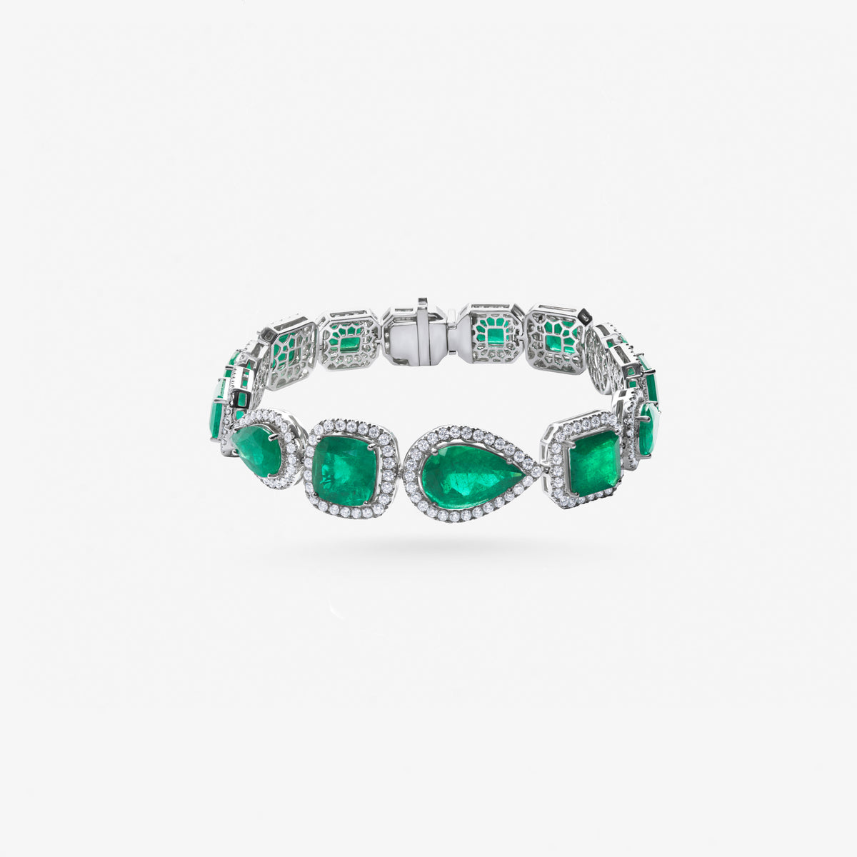Peter Marco 18k white gold pear and cushion cut emerald with round cut diamond bracelet