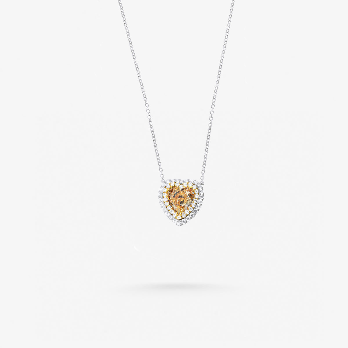 Peter Marco 18k white gold round cut diamonds and yellow diamond pendant
