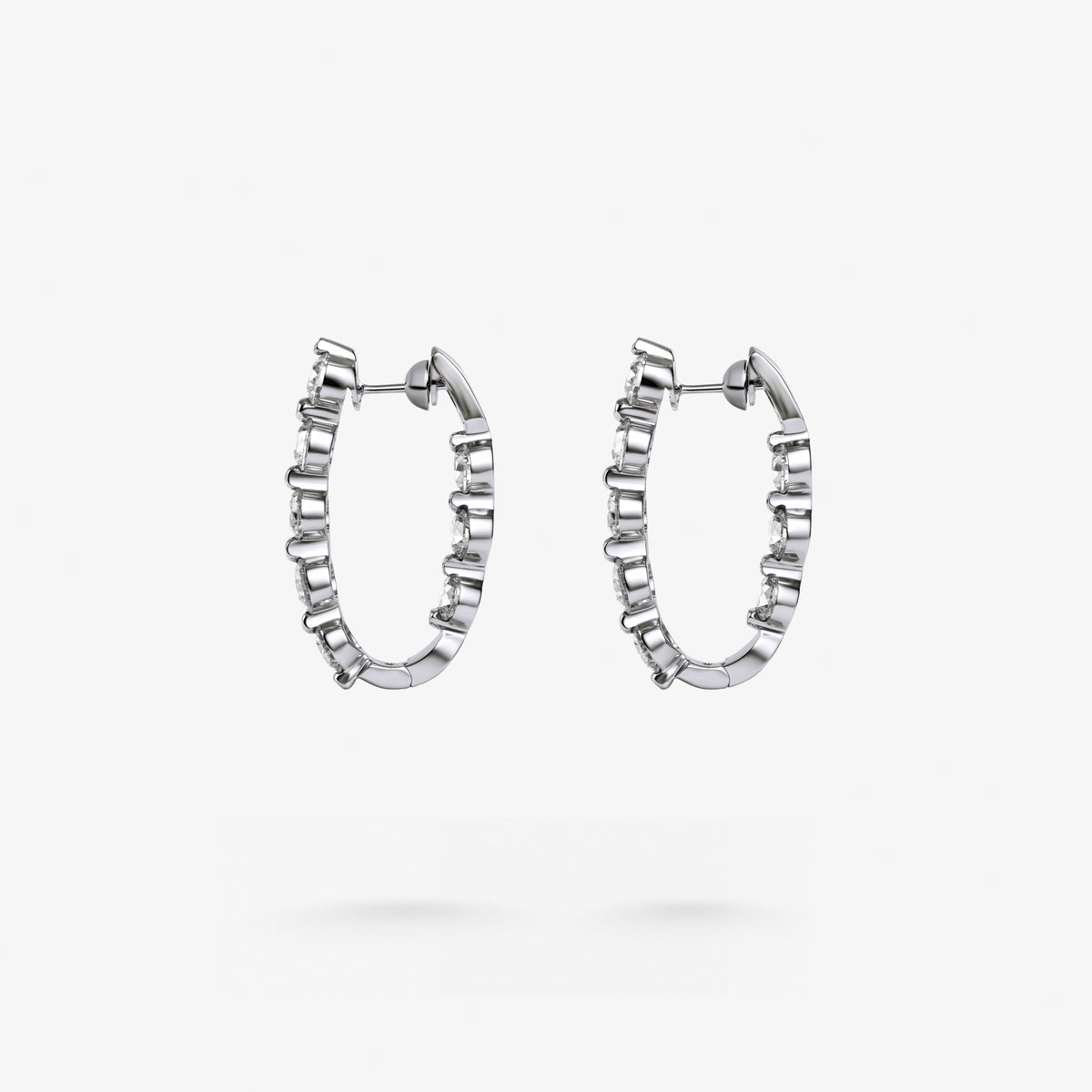 Peter Marco 18k white gold round cut white diamond drop earrings, side view