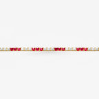 Peter Marco 18k yellow gold round cut diamond and ruby bracelet, detail view