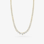 Peter Marco 18k yellow gold three-prong graduated round cut diamond necklace