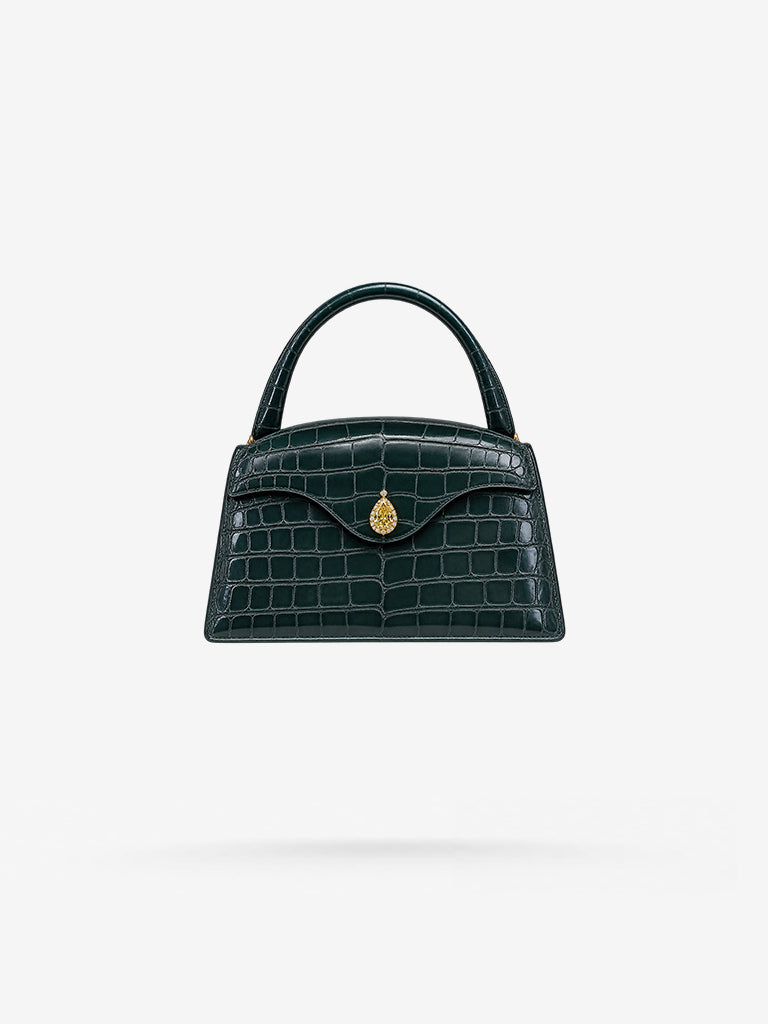 Peter Marco custom bag with a center stone over the opening flap made for a special client