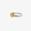 18K white and yellow gold diamond ring with round and baguette-cut diamonds side view.
