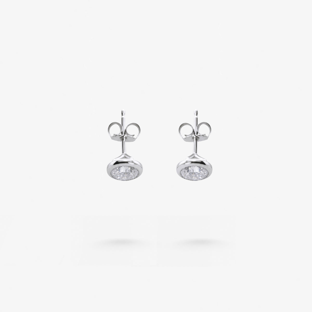 Peter Marco bezel set round cut diamond stud earrings, top down view