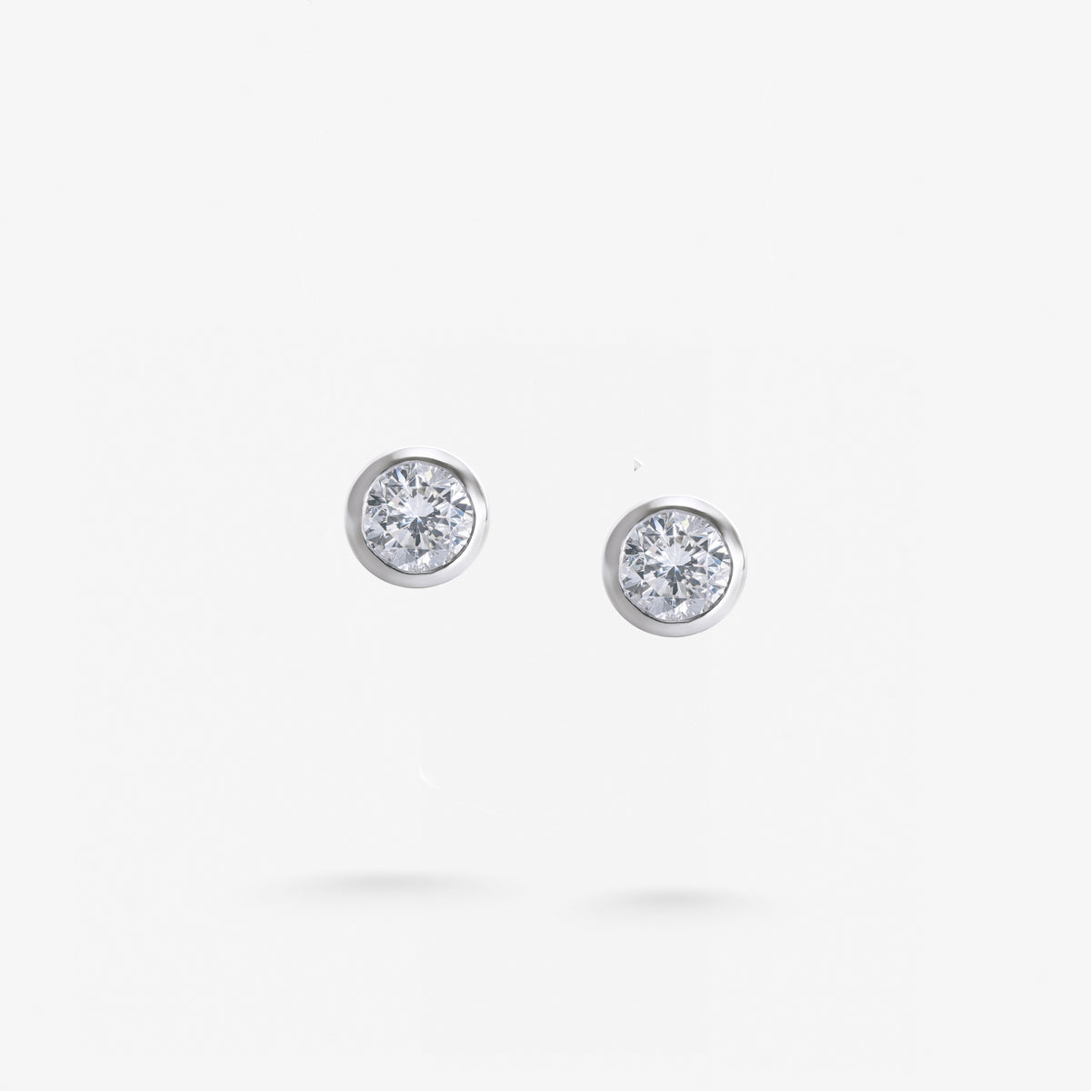 Peter Marco bezel set round cut diamond stud earrings