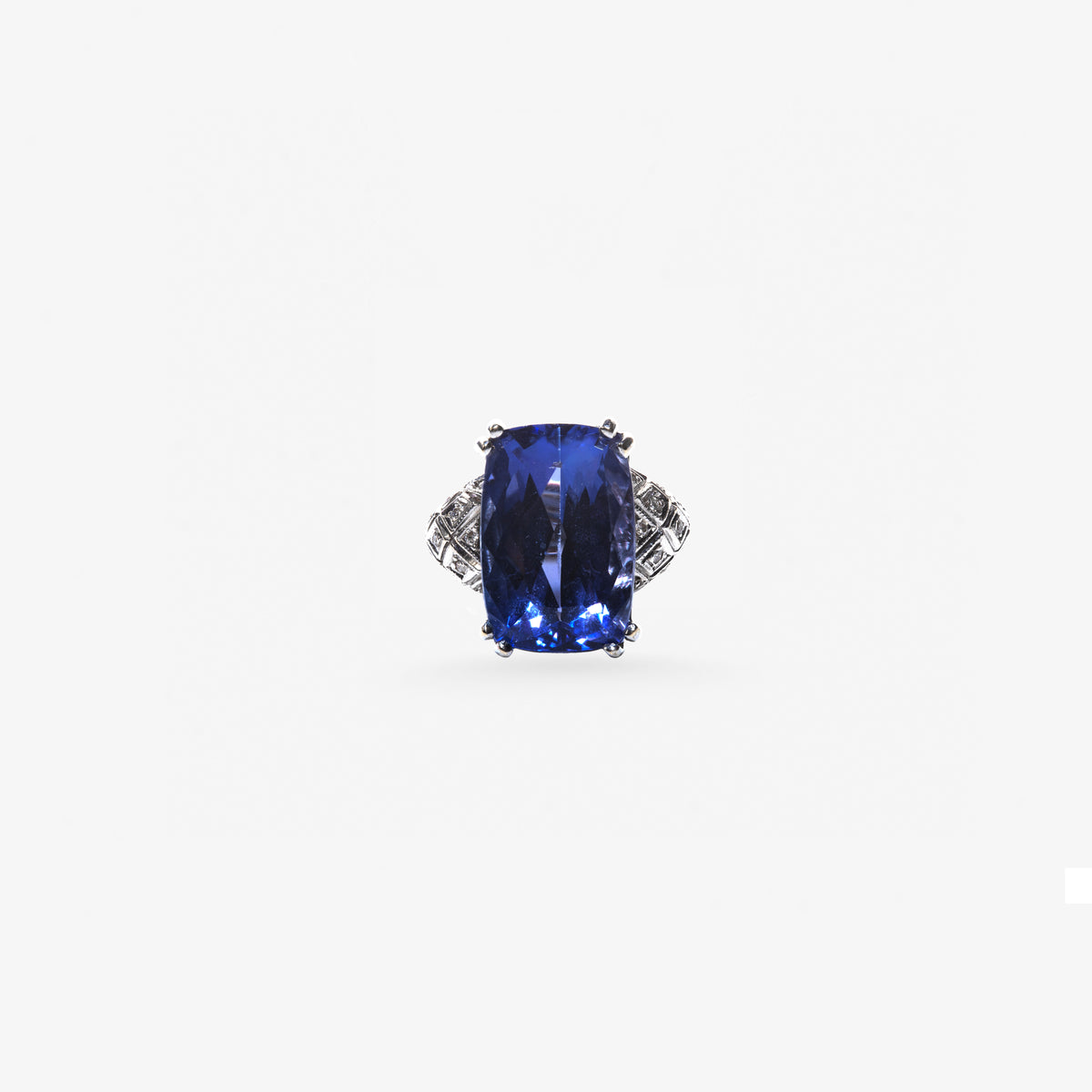 Peter Marco elongated blue sapphire ring with geometric diamond detailing on the shoulders