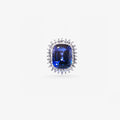 Peter Marco blue sapphire ring with a floral diamond and intricate white metal setting.