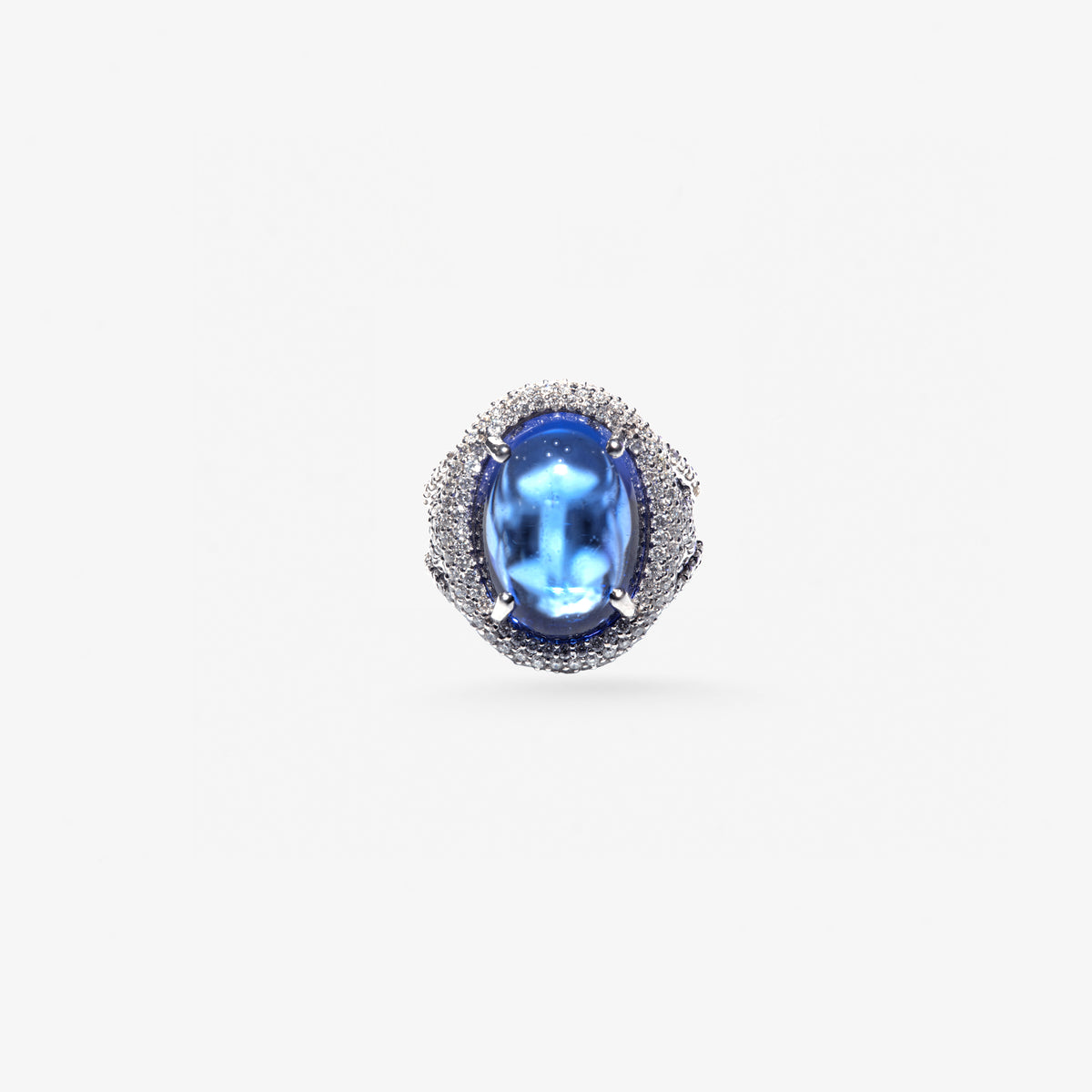 Peter Marco blue oval gemstone ring surrounded by a diamond halo 