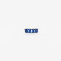 Peter Marco blue sapphire eternity band featuring rectangular step-cut gemstones in a white metal setting