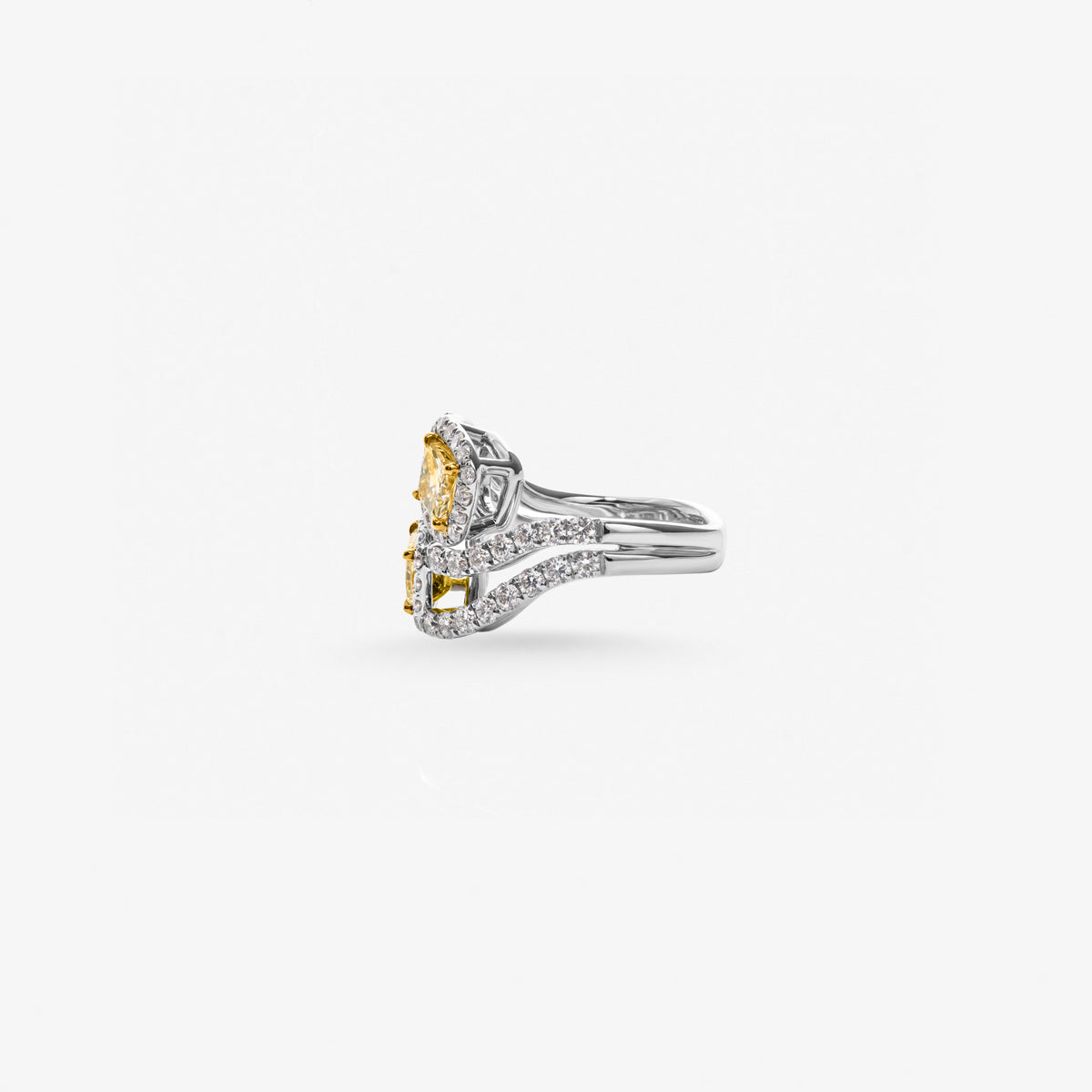 Peter Marco cushion cut yellow diamond and round cut diamond crossover ring, side view