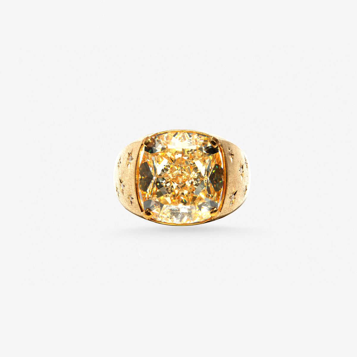 Peter Marco yellow diamond ring featuring a large cushion-cut center diamond in a sculpted yellow gold setting with engraved detailing.