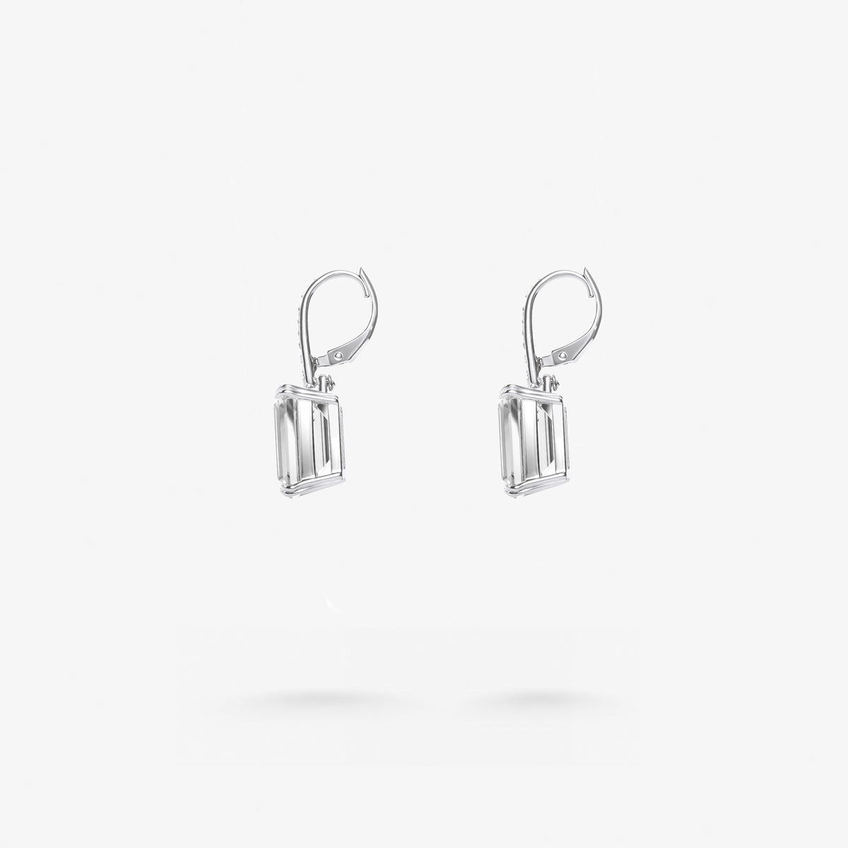 Peter Marco emerald cut and round cut white diamond drop earrings, side view