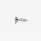 Peter Marco emerald cut emerald and round cut diamond halo ring, side view