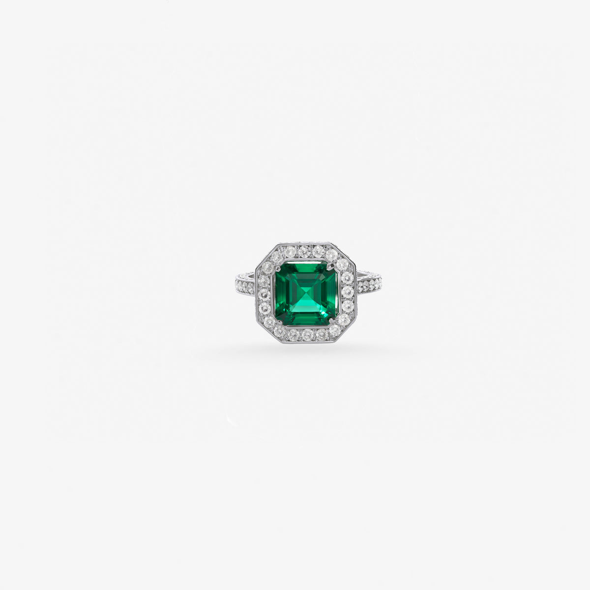 Peter Marco emerald cut emerald and round cut diamond halo ring
