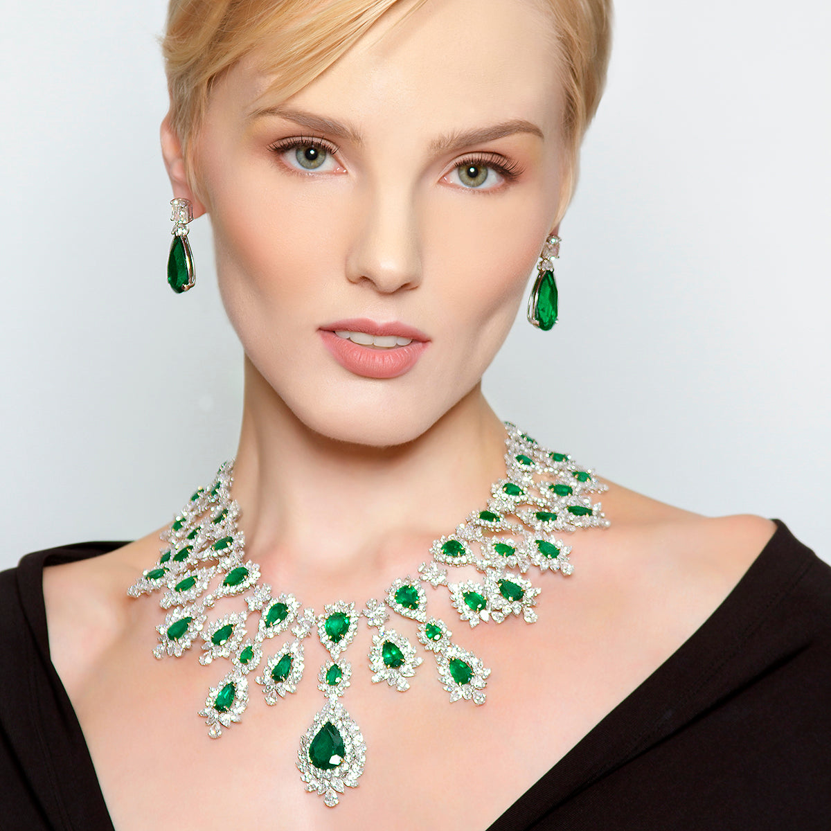 Peter Marco girl model wearing a emerald necklace and emerald earrings