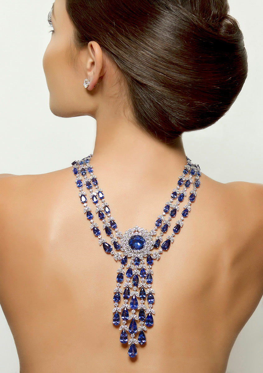 peter marco girl model wearing blue sapphire and white diamond necklace