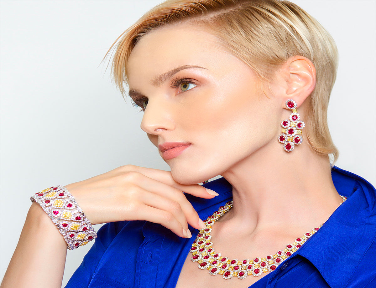 Peter Marco girl model wearing yellow diamond and white diamond ruby matching bracelet, necklace,earrings
