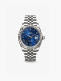 Peter Marco Rolex Datejust stainless steel watch with blue sunburst dial, Roman numeral hour markers, fluted bezel, and Jubilee bracelet