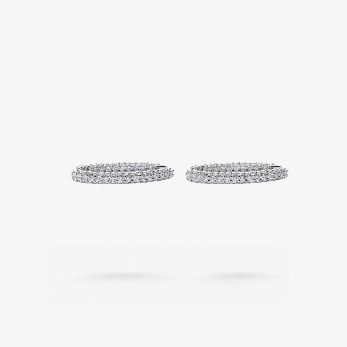 Peter Marco round cut diamond oval hoop earrings, side view