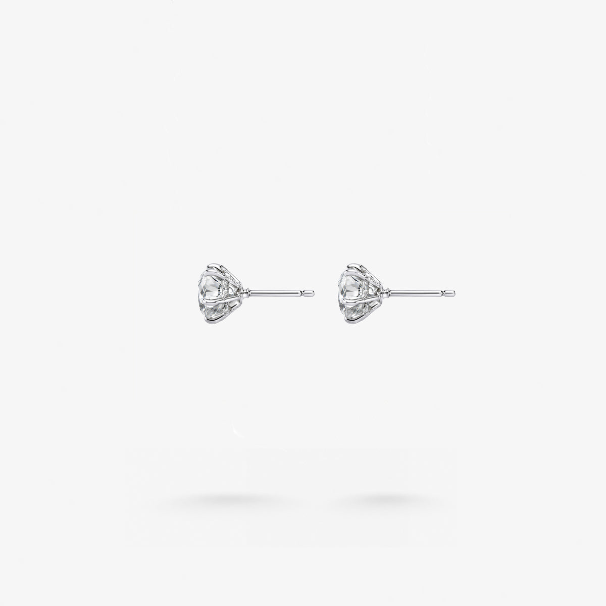 Peter Marco round cut white diamond stud earrings, side view