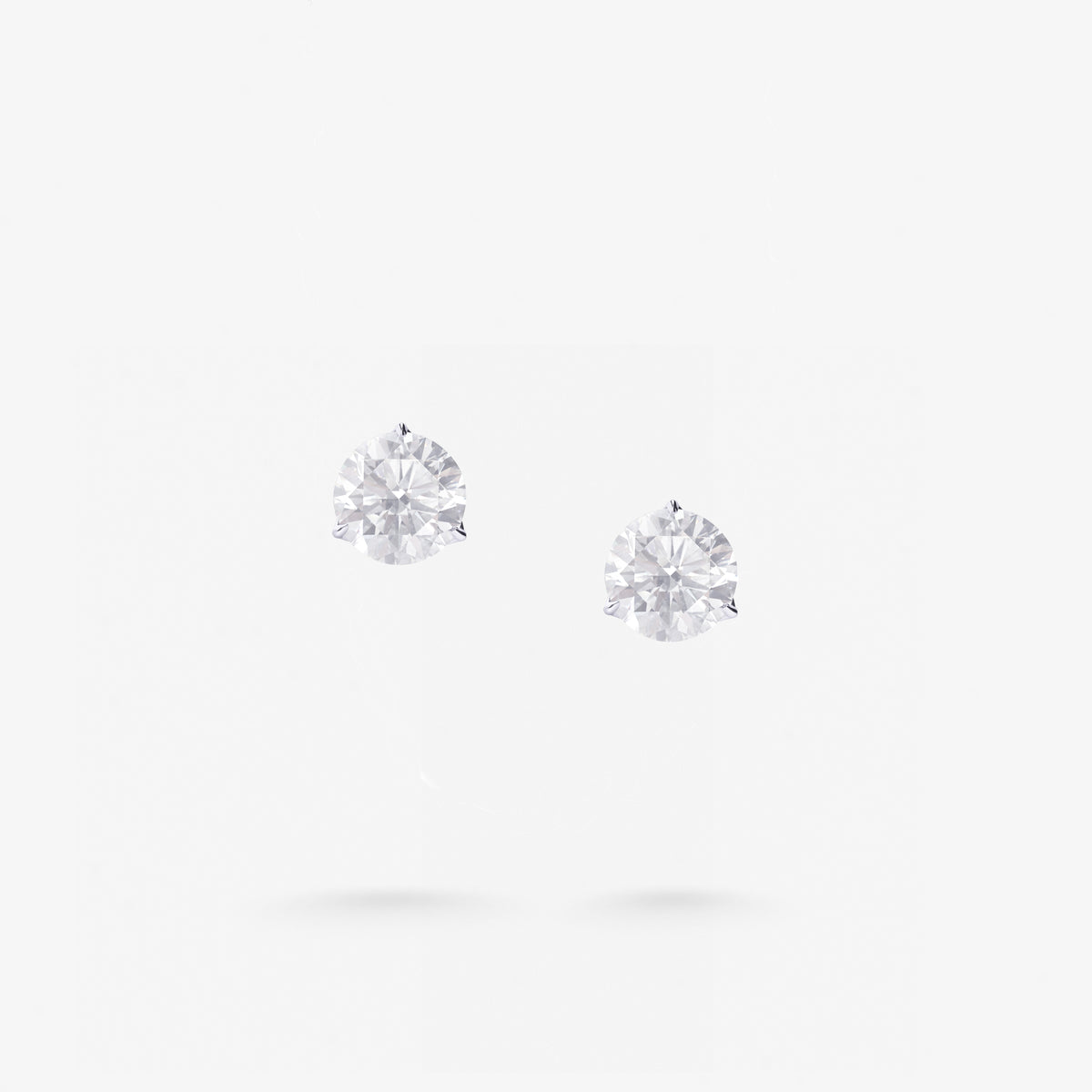 Peter Marco three-prong round cut diamond stud earrings