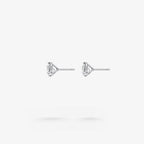 Peter Marco three-prong round cut white diamond stud earrings, side view