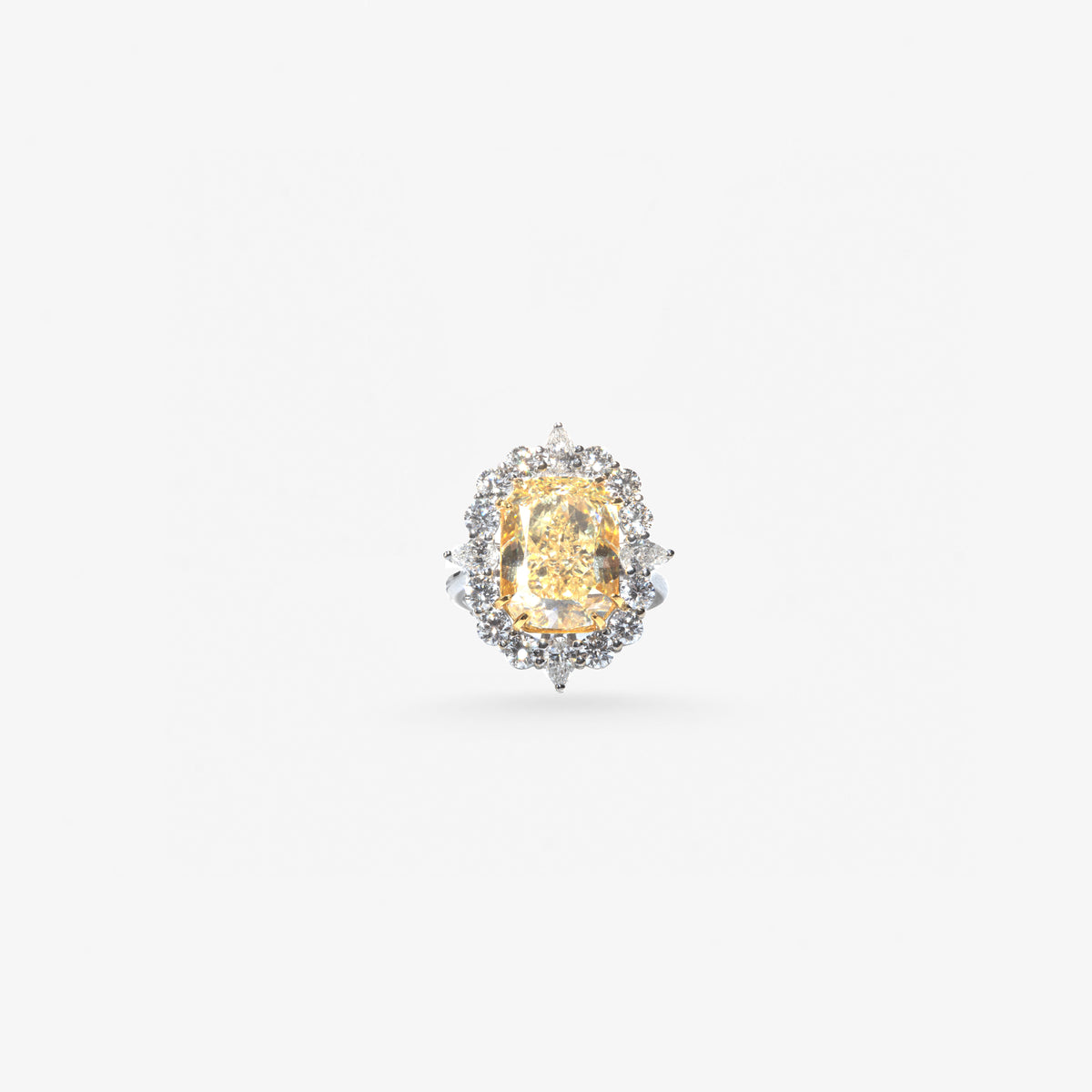 Peter Marco yellow diamond halo ring surrounded by white diamonds in a floral-inspired setting